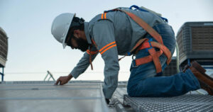 Flat roof maintenance and leak prevention work on a Brooklyn building